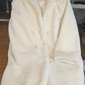 Colors of Benneton cream colored coat in mint condition.